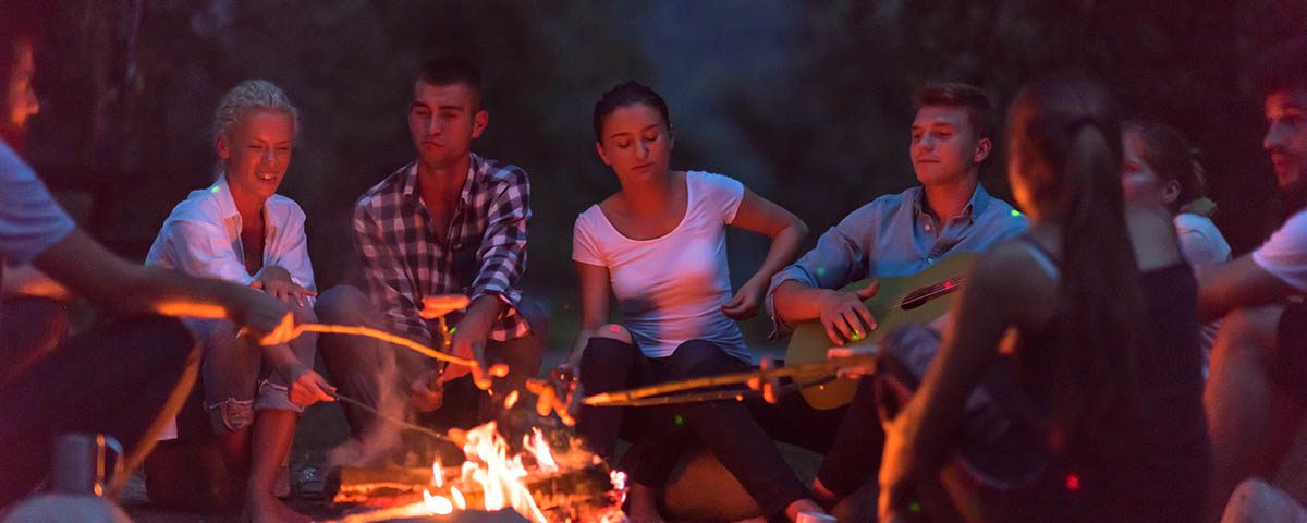 group of campers around a campfire enjoying the peace and tranquility of camping at Beaver Springs Campground in Piedmont MO