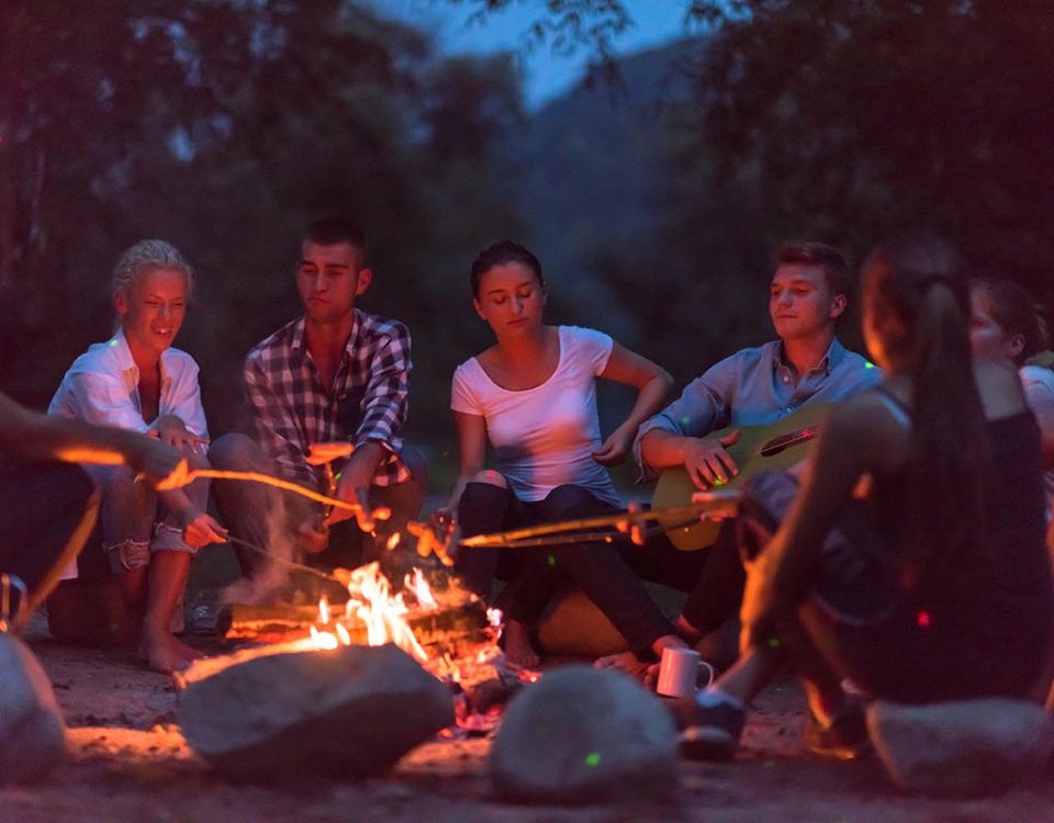 group of campers around a campfire enjoying the peace and tranquility of camping at Beaver Springs Campground in Piedmont MO